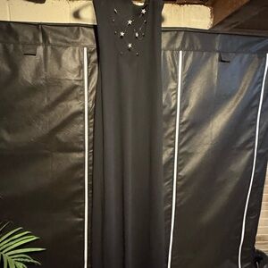 Niki Lavis Elegant Black Gown with Star Embellishments